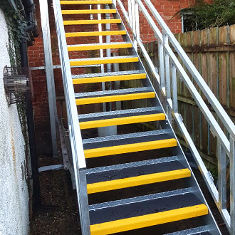 Yellow and white Stair Treads exit stairway. Yellow and white Stair Treads exit stairway.
