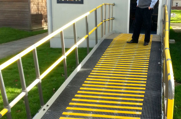 High visibility yellow anti slip decking strips for wheelchair access.